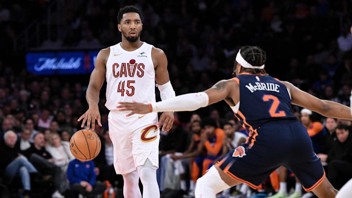 Oct 28, 2024; New York, New York, USA; Cleveland Cavaliers guard Donovan Mitchell (45) sets the play as New York Knicks guard Miles McBride (2) defends during the second half at Madison Square Garden. Mandatory Credit: John Jones-Imagn Images