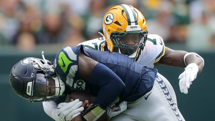Green Bay Packers linebacker Quay Walker (7) tackles Seattle Seahawks quarterback Jalen Milroe during the preseason. Green Bay Packers linebacker Quay Walker (7) tackles Seattle Seahawks quarterback Jalen Milroe during the preseason.