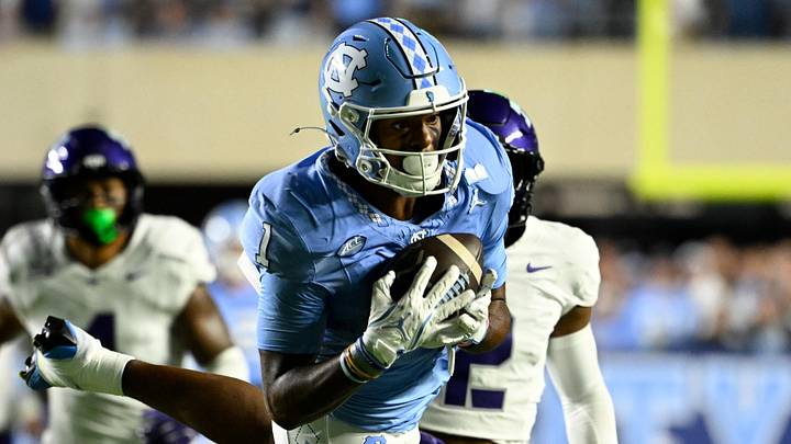Sep 1, 2025; Chapel Hill, North Carolina, USA; North Carolina Tar Heels wide receiver Jordan Shipp (1) catches a long pass as TCU Horned Frogs safety Jamel Johnson (2) defends in the first quarter at Kenan Stadium. Mandatory Credit: Bob Donnan-Imagn Images Sep 1, 2025; Chapel Hill, North Carolina, USA; North Carolina Tar Heels wide receiver Jordan Shipp (1) catches a long pass as TCU Horned Frogs safety Jamel Johnson (2) defends in the first quarter at Kenan Stadium. Mandatory Credit: Bob Donnan-Imagn Images