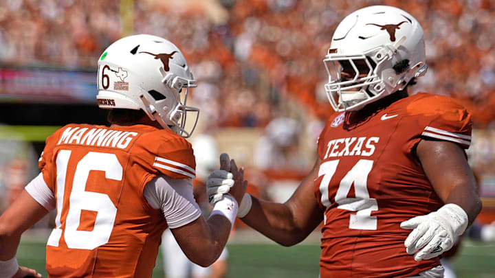 Texas Longhorns quarterback Arch Manning (16) and offensive lineman Trevor Goosby (74) react after Manning ran for a touchdown during the first half against the Texas El Paso Miners at Darrell K Royal-Texas Memorial Stadium. Mandatory Credit: Scott Wachter-Imagn Images