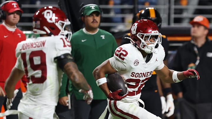 Oklahoma Sooners defensive back Peyton Bowen (22) runs an interception back against the Tennessee Volunteers during the second quarter at Neyland Stadium. 