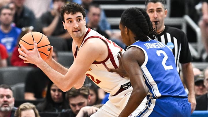 Mar 22, 2026; St. Louis, MO, USA; Iowa State Cyclones forward Milan Momcilovic (22) looks to pass as Kentucky Wildcats guard Jasper Johnson (2) defends during the first half during a second round game of the men's 2026 NCAA Tournament at Enterprise Center.