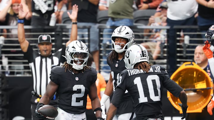 Sep 28, 2025; Paradise, Nevada, USA; Las Vegas Raiders running back Ashton Jeanty (2) celebrates a touchdown during the first quarter against the Chicago Bears at Allegiant Stadium. Mandatory Credit: Kiyoshi Mio-Imagn Images