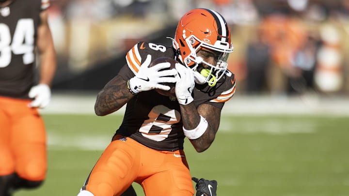 Oct 27, 2024; Cleveland, Ohio, USA; Cleveland Browns wide receiver Elijah Moore (8) makes a catch for a first down under coverage by Baltimore Ravens cornerback Brandon Stephens (21) during the fourth quarter at Huntington Bank Field. Mandatory Credit: Scott Galvin-Imagn Images