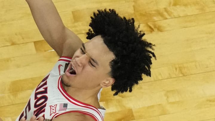 Apr 4, 2026; Indianapolis, IN, USA; Arizona Wildcats guard Brayden Burries (5) shoots against Michigan Wolverines center Aday Mara (15) in the second half during a semifinal of the Final Four of the men's 2026 NCAA Tournament at Lucas Oil Stadium. Mandatory Credit: Robert Deutsch-Imagn Images