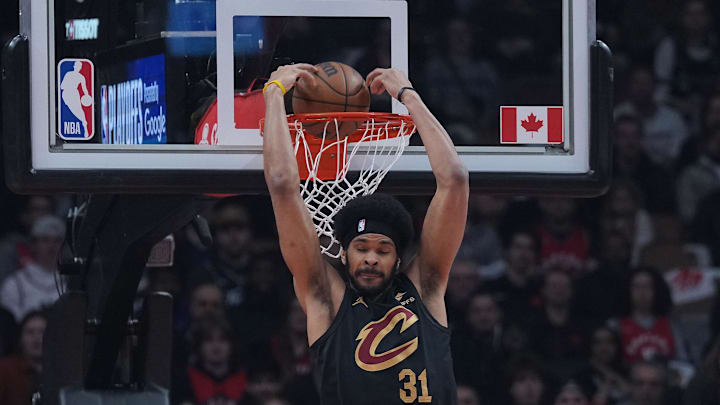 May 1, 2026; Toronto, Ontario, CAN; Cleveland Cavaliers center Jarrett Allen (31) scores a basket over Toronto Raptors center Jakob Poeltl (19) during the first quarter in game six of the first round of the 2026 NBA Playoffs at Scotiabank Arena. Mandatory Credit: Nick Turchiaro-Imagn Images