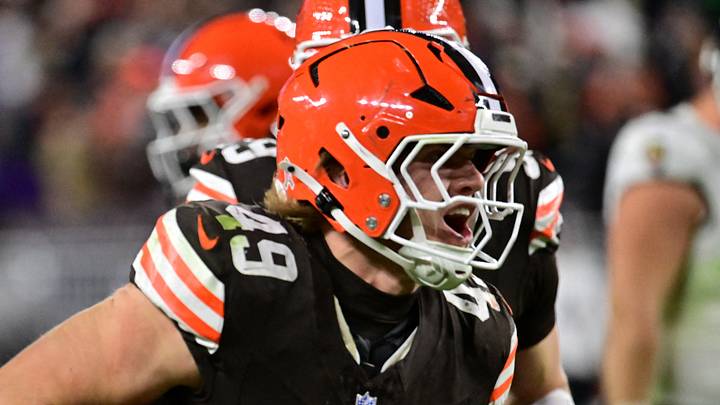 Carson Schwesinger (49) celebrates an interception during the third quarter against the Baltimore Ravens at Huntington Bank Field.