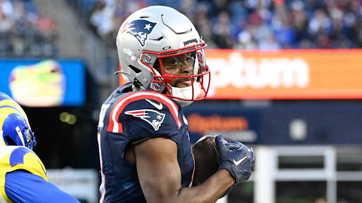 Nov 17, 2024; Foxborough, Massachusetts, USA; New England Patriots wide receiver Kayshon Boutte (9) tries to break a tackle by Los Angeles Rams cornerback Darious Williams (24) during the second half at Gillette Stadium. Mandatory Credit: Eric Canha-Imagn Images Nov 17, 2024; Foxborough, Massachusetts, USA; New England Patriots wide receiver Kayshon Boutte (9) tries to break a tackle by Los Angeles Rams cornerback Darious Williams (24) during the second half at Gillette Stadium. Mandatory Credit: Eric Canha-Imagn Images