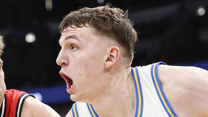 Mar 12, 2026; Chicago, IL, USA; UCLA Bruins forward Tyler Bilodeau (34) drives to the basket against Rutgers Scarlet Knights guard Harun Zrno (13) during the second half at United Center. Mandatory Credit: Kamil Krzaczynski-Imagn Images