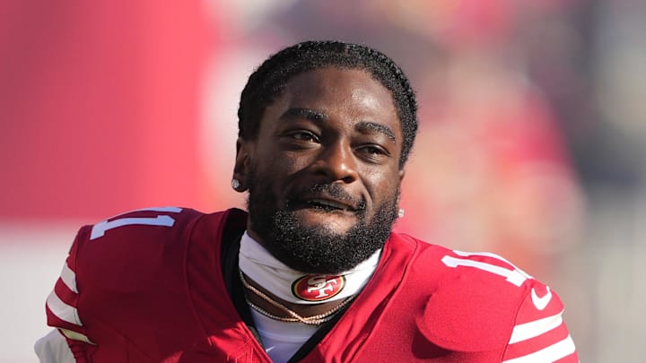 San Francisco 49ers wide receiver Brandon Aiyuk walks onto the field.