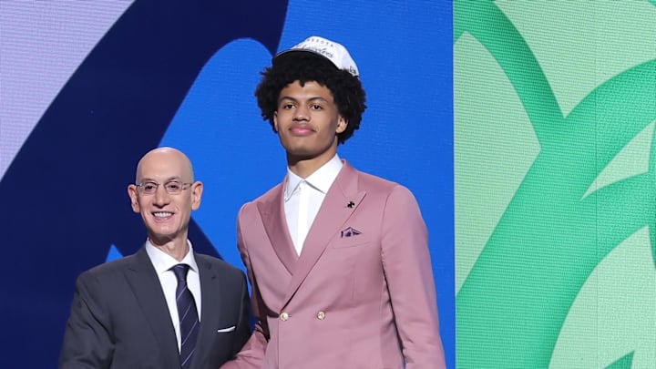 Jun 25, 2025; Brooklyn, NY, USA;  Joan Beringer stands with NBA commissioner Adam Silver after being selected as the 17th pick by the Minnesota Timberwolves in the first round of the 2025 NBA Draft at Barclays Center. Mandatory Credit: Brad Penner-Imagn Images