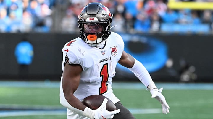Dec 21, 2025; Charlotte, North Carolina, USA; Tampa Bay Buccaneers running back Rachaad White (1) with the ball in the third quarter at Bank of America Stadium. Mandatory Credit: Bob Donnan-Imagn Images