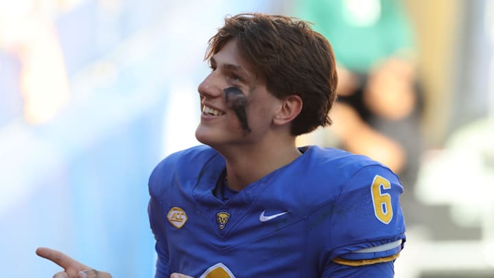 Oct 4, 2025; Pittsburgh, Pennsylvania, USA; Pittsburgh Panthers quarterback Mason Heintschel (6) leads the Pitt Band in the playing of the alma mater after defeating the Boston College Eagles at Acrisure Stadium. Mandatory Credit: Charles LeClaire-Imagn Images Oct 4, 2025; Pittsburgh, Pennsylvania, USA; Pittsburgh Panthers quarterback Mason Heintschel (6) leads the Pitt Band in the playing of the alma mater after defeating the Boston College Eagles at Acrisure Stadium. Mandatory Credit: Charles LeClaire-Imagn Images