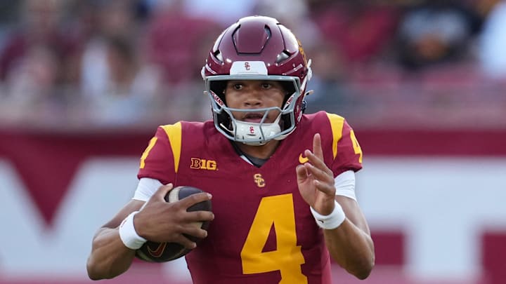 Aug 30, 2025; Los Angeles, California, USA; Southern California Trojans quarterback Husan Longstreet (4) carries the ball against the Missouri State Bears in the second half at United Airlines Field at Los Angeles Memorial Coliseum. Mandatory Credit: Kirby Lee-Imagn Images