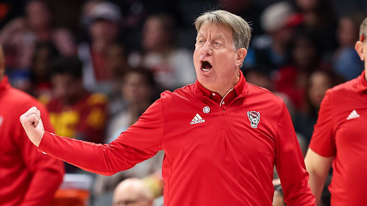 Nov 9, 2025; Charlotte, North Carolina, USA; NC State Wolfpack head coach Wes Moore in action against the Southern California Trojans during the fourth quarter of the Ally Tipoff game at Spectrum Center. Mandatory Credit: Cory Knowlton-Imagn Images Nov 9, 2025; Charlotte, North Carolina, USA; NC State Wolfpack head coach Wes Moore in action against the Southern California Trojans during the fourth quarter of the Ally Tipoff game at Spectrum Center. Mandatory Credit: Cory Knowlton-Imagn Images