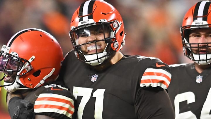 Oct 21, 2021; Cleveland, Ohio, USA; Cleveland Browns running back D'Ernest Johnson (30) celebrates with guard Wyatt Teller (77) and offensive tackle Jedrick Wills (71) and center JC Tretter (64) after rushing for a first down and securing the game during the fourth quarter against the Denver Broncos at FirstEnergy Stadium. Mandatory Credit: Ken Blaze-Imagn Images