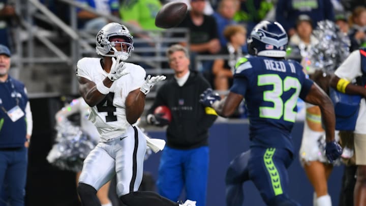 Aug 7, 2025; Seattle, Washington, USA; Las Vegas Raiders wide receiver Shedrick Jackson (4) catches a pass for a touchdown against the Seattle Seahawks during the second half at Lumen Field. Mandatory Credit: Steven Bisig-Imagn Images