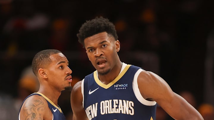 Dec 2, 2024; Atlanta, Georgia, USA; New Orleans Pelicans guard Dejounte Murray (5) talks to center Yves Missi (21) against the Atlanta Hawks in the second quarter at State Farm Arena. Mandatory Credit: Brett Davis-Imagn Images