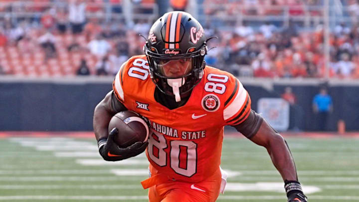 Oklahoma State's Brennan Presley (80) scores a 2-point conversion in the second half of the college football between the Oklahoma State University Cowboys and the Utah Utes at Boone Pickens Stadium in Stillwater, Okla., Saturday, Sept., 21, 2024.