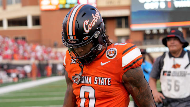 Oklahoma State's Ollie Gordon II (0) walks off the field following the college football between the Oklahoma State University Cowboys and the Utah Utes at Boone Pickens Stadium in Stillwater, Okla., Saturday, Sept., 21, 2024.