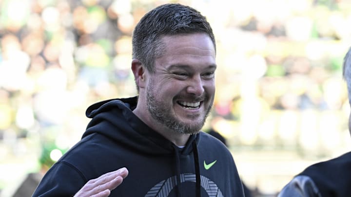 Nov 22, 2025; Eugene, Oregon, USA; Oregon Ducks head coach Dan Lanning smiles before the game against the Southern California Trojans at Autzen Stadium. Mandatory Credit: Troy Wayrynen-Imagn Images