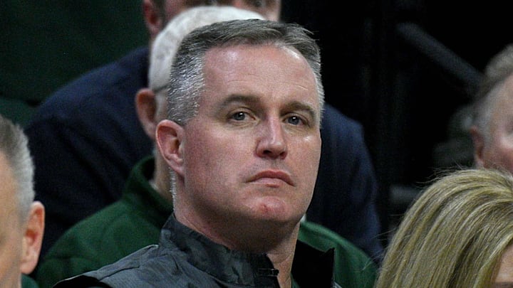 Dec 2, 2025; East Lansing, Michigan, USA;  Michigan State head football coach Pat Fitzgerald watches the Spartans defeat the Iowa Hawkeyes at Jack Breslin Student Events Center.