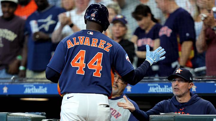 Houston Astros left fielder Yordan Alvarez (44) is congratulated in the dugout by manager Joe Espada (19) after hitting a home run. Houston Astros left fielder Yordan Alvarez (44) is congratulated in the dugout by manager Joe Espada (19) after hitting a home run.