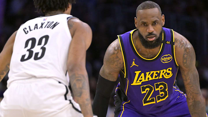 Brooklyn Nets center Nic Claxton (33) guards Los Angeles Lakers forward LeBron James (23) at Crypto.com Arena.