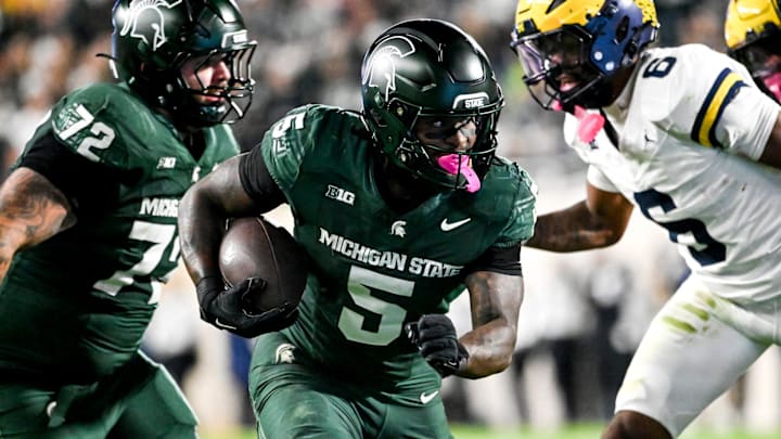 Michigan State's Makhi Frazier runs for a gain against Michigan during the second quarter on Saturday, Oct. 25, 2025, at Spartan Stadium in East Lansing. Michigan State's Makhi Frazier runs for a gain against Michigan during the second quarter on Saturday, Oct. 25, 2025, at Spartan Stadium in East Lansing.