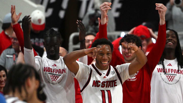 Feb 17, 2026; Raleigh, North Carolina, USA; The NC State Wolfpack bench reacts late in the second half against the North Carolina Tar Heels at Lenovo Center. Mandatory Credit: Zachary Taft-Imagn Images Feb 17, 2026; Raleigh, North Carolina, USA; The NC State Wolfpack bench reacts late in the second half against the North Carolina Tar Heels at Lenovo Center. Mandatory Credit: Zachary Taft-Imagn Images