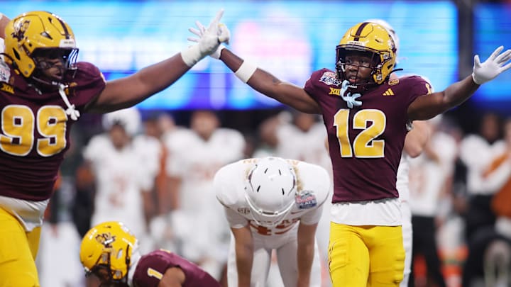 Jan 1, 2025; Atlanta, GA, USA; Arizona State Sun Devils defensive lineman C.J. Fite (99) and defensive back Javan Robinson (12) react after a play against the Texas Longhorns during the second half of the Peach Bowl at Mercedes-Benz Stadium. Mandatory Credit: Brett Davis-Imagn Images Jan 1, 2025; Atlanta, GA, USA; Arizona State Sun Devils defensive lineman C.J. Fite (99) and defensive back Javan Robinson (12) react after a play against the Texas Longhorns during the second half of the Peach Bowl at Mercedes-Benz Stadium. Mandatory Credit: Brett Davis-Imagn Images