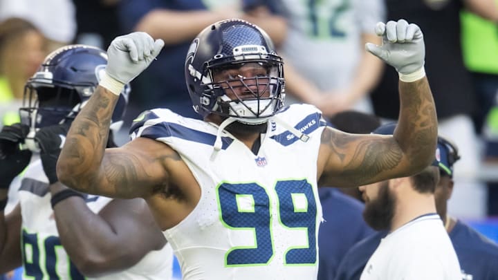 Dec 8, 2024; Glendale, Arizona, USA; Seattle Seahawks defensive end Leonard Williams (99) celebrates against the Arizona Cardinals in the first half at State Farm Stadium.
