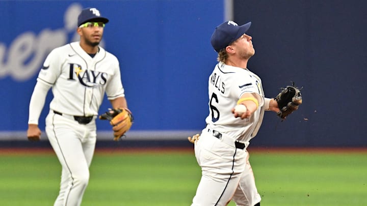 Apr 20, 2026; St. Petersburg, Florida, USA; Tampa Bay Rays shortstop Taylor Walls (6) throws to first base in the second  inning against the Cincinnati Reds at Tropicana Field. 