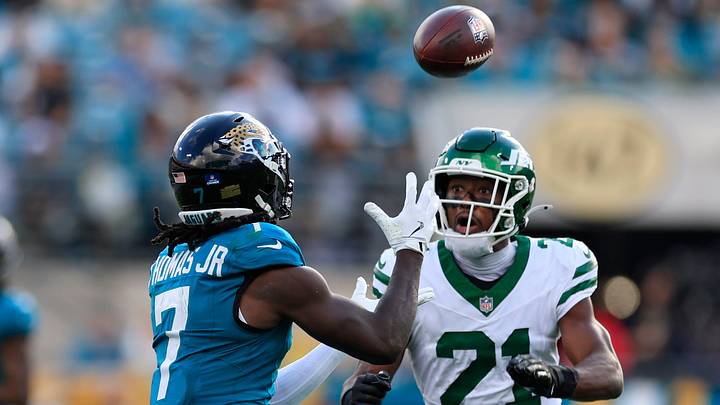 Jacksonville Jaguars wide receiver Brian Thomas Jr. (7) hauls in a reception against New York Jets cornerback Brandon Stephens (21) during the third quarter of a NFL football matchup at EverBank Stadium, Sunday, Dec. 14, 2025, in Jacksonville, Fla. The Jaguars defeated the Jets 48-20. [Corey Perrine/Florida Times-Union]