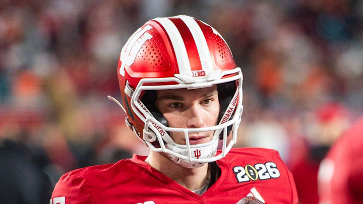 Indiana's Fernando Mendoza (15) gets loose before the College Football Playoff National Championship college football game at Hard Rock Stadium in Miami Gardens on Monday, Jan. 19, 2026.