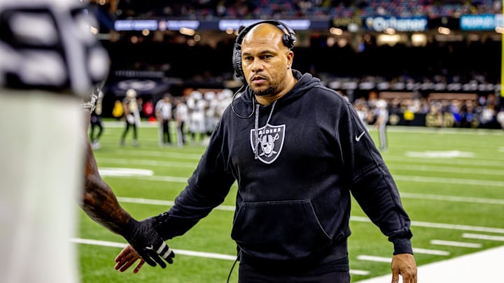 Dec 29, 2024; New Orleans, Louisiana, USA;  Las Vegas Raiders head coach Antonio Pierce congratulates players after an interception against the New Orleans Saints during the second half at Caesars Superdome. Mandatory Credit: Stephen Lew-Imagn Images
