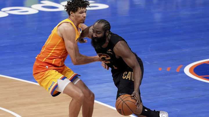 Feb 20, 2026; Charlotte, North Carolina, USA; Cleveland Cavaliers guard James Harden (1) drives against Charlotte Hornets forward Tidjane Salaun (31) during the second half at the Spectrum Center. Mandatory Credit: Jim Dedmon-Imagn Images