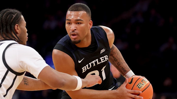 Mar 12, 2025; New York, NY, USA; Butler Bulldogs forward Pierre Brooks II (21) controls the ball against Providence Friars forward Rich Barron (10) during the first half at Madison Square Garden. Mandatory Credit: Brad Penner-Imagn Images