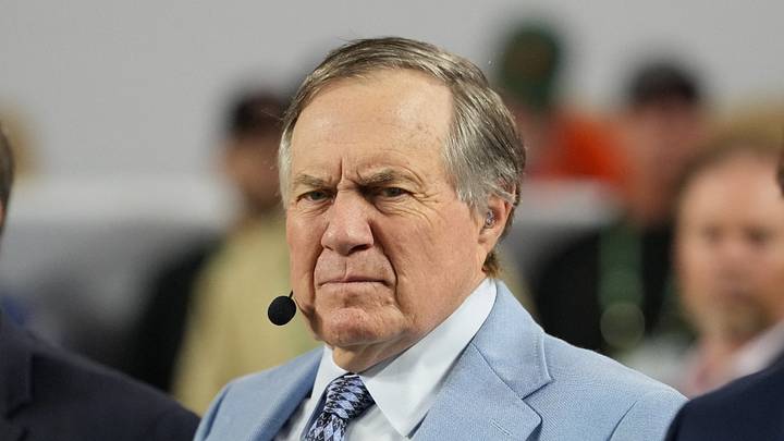 Jan 19, 2026; Miami Gardens, FL, USA; TV analyst Bill Belichick watches the Miami Hurricanes play the Indiana Hoosiers during the first half of the College Football Playoff National Championship game at Hard Rock Stadium. Mandatory Credit: Kirby Lee-Imagn Images