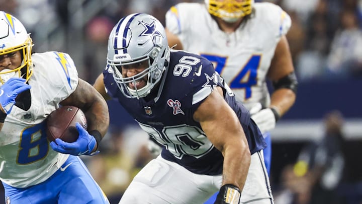 Los Angeles Chargers running back Omarion Hampton rushes ahead of Dallas Cowboys defensive tackle Solomon Thomas during the fourth quarter at AT&T Stadium. 