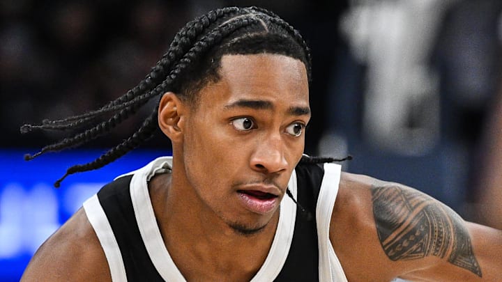 Jan 25, 2025; Minneapolis, Minnesota, USA; Minnesota Timberwolves guard Rob Dillingham (4) controls the ball against the Denver Nuggets during the fourth quarter at Target Center. Mandatory Credit: Jeffrey Becker-Imagn Images