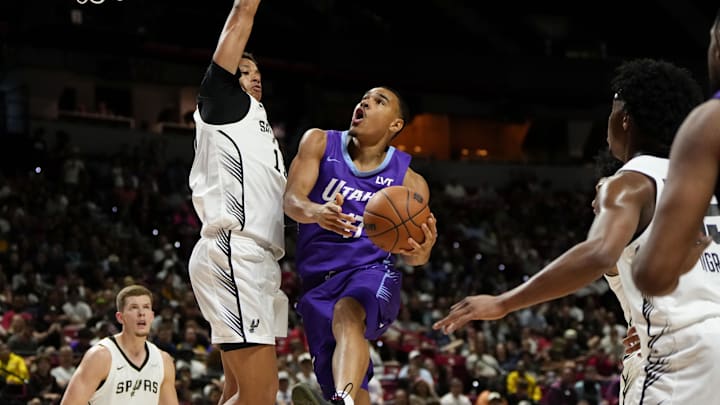 Jul 14, 2025; Las Vegas, NV, USA;  Utah Jazz forward John Tonje (17) drives towards the basket against San Antonio Spurs forward Carter Bryant (11) during the first half of a NBA basketball game at the Thomas & Mack Center. Mandatory Credit: Lucas Peltier-Imagn Images