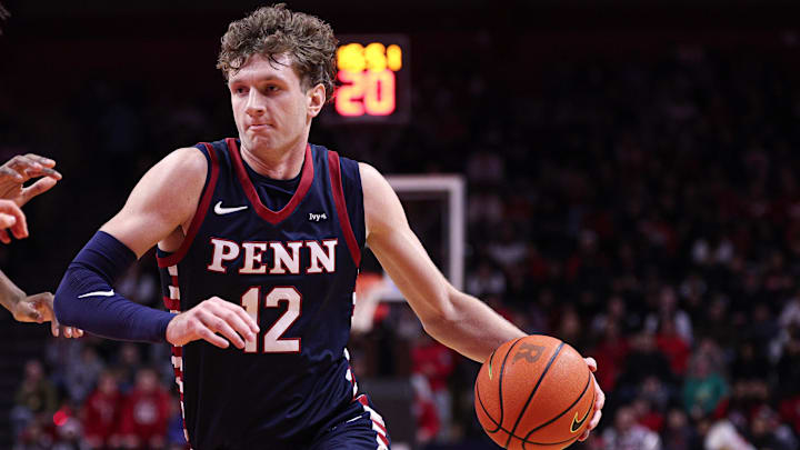 Dec 20, 2025; Piscataway, New Jersey, USA; Penn Quakers forward TJ Power (12) goes to the basket against Rutgers Scarlet Knights.
