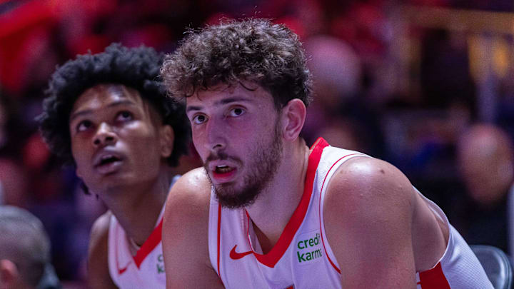 Jan 12, 2024; Detroit, Michigan, USA; Houston Rockets center Alperen Sengun (28) and forward Amen Thompson (1) sit on the sidelines on a play stoppage against the Detroit Pistons during the in the first half at Little Caesars Arena. Mandatory Credit: David Reginek-Imagn Images