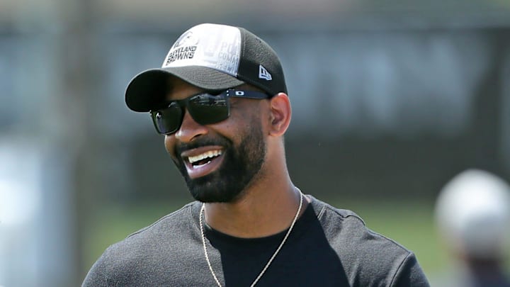 Browns general manager Andrew Berry, right, shares a laugh with cornerback Justin Hardee Sr. after minicamp practice June 13, 2024, in Berea.