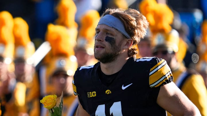 Iowa Hawkeyes quarterback Mark Gronowski (11) runs onto the field during senior recognition Nov. 22, 2025 at Kinnick Stadium in Iowa City, Iowa.