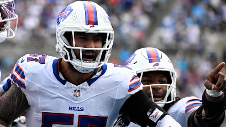 Oct 26, 2025; Charlotte, North Carolina, USA;  Buffalo Bills defensive end AJ Epenesa (57) celebrates with guard Connor McGovern (66) and linebacker Dorian Williams (42)  after intercepting a pass in the second quarter against the Carolina Panthers at Bank of America Stadium.