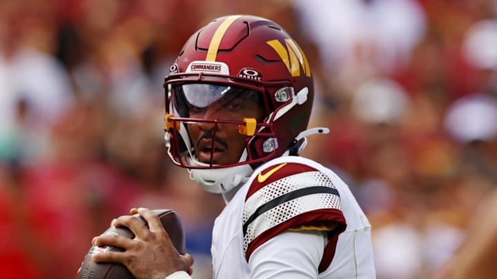 Sep 7, 2025; Landover, Maryland, USA; Washington Commanders quarterback Jayden Daniels (5) drops back to pass during the first quarter against the New York Giants at Northwest Stadium. Mandatory Credit: Peter Casey-Imagn Images