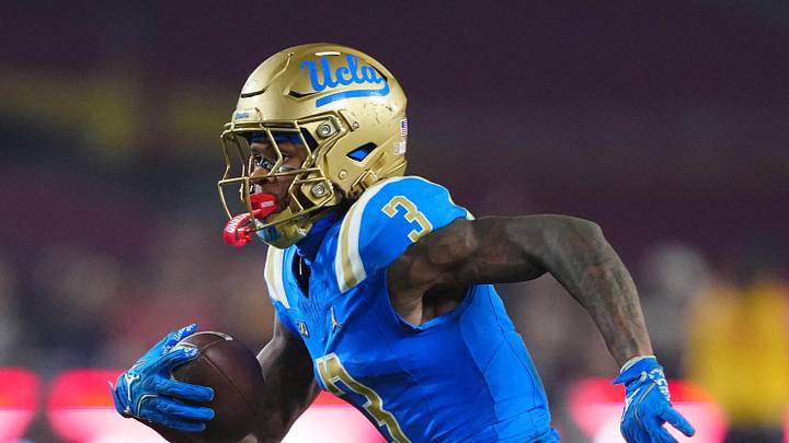 Nov 29, 2025; Los Angeles, California, USA; UCLA Bruins wide receiver Kwazi Gilmer (3) carries the ball against the Southern California Trojans in the second half at United Airlines Field at Los Angeles Memorial Coliseum. Mandatory Credit: Kirby Lee-Imagn Images