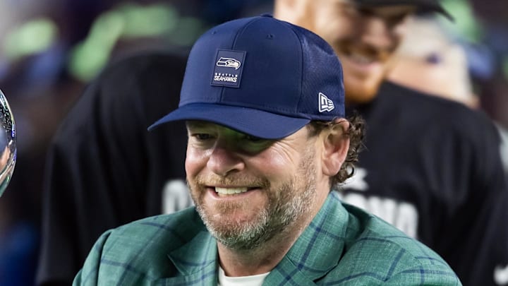 Seattle Seahawks general manager John Schneider celebrates with the Vince Lombardi trophy.